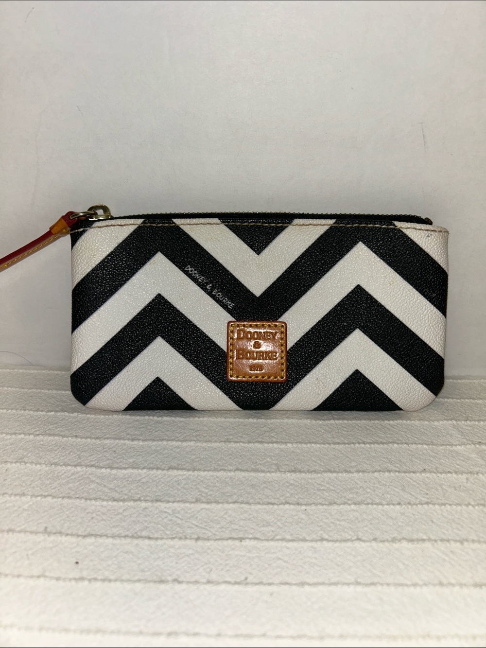 Dooney & Bourke Black and White Chevron Wristlet with Tan Leather Patch